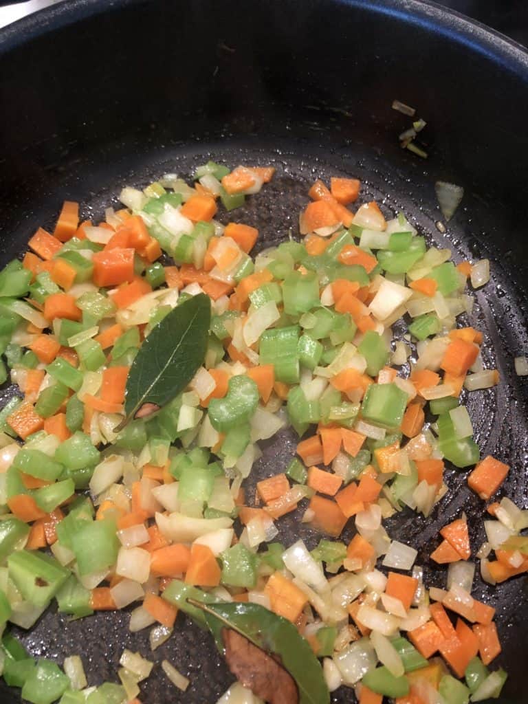 sautéing onion, carrot, garlic and celery