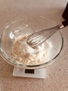 whisking flour and sugar to make scones
