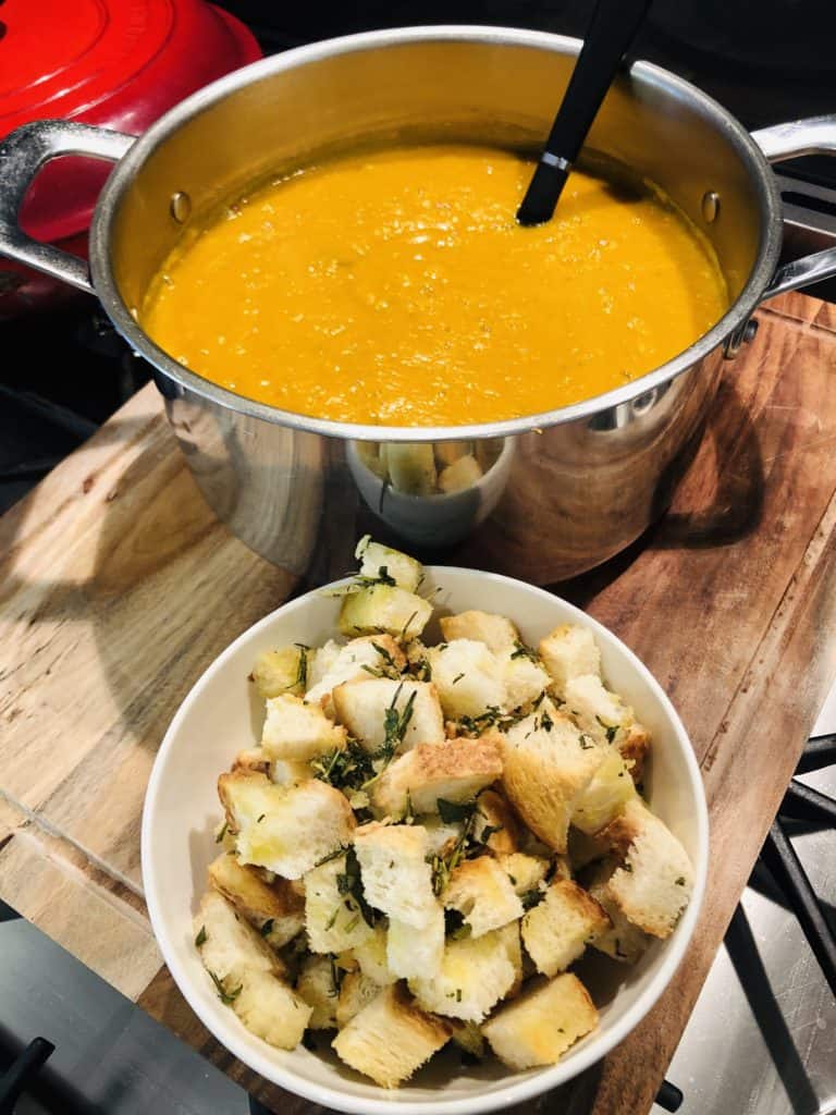 creamy pumpkin soup with thyme and garlic croutons