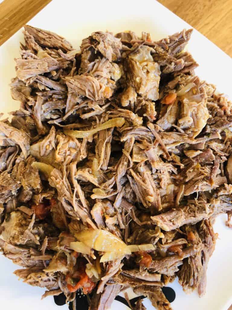 shredded beef cooked in the slow cooker 