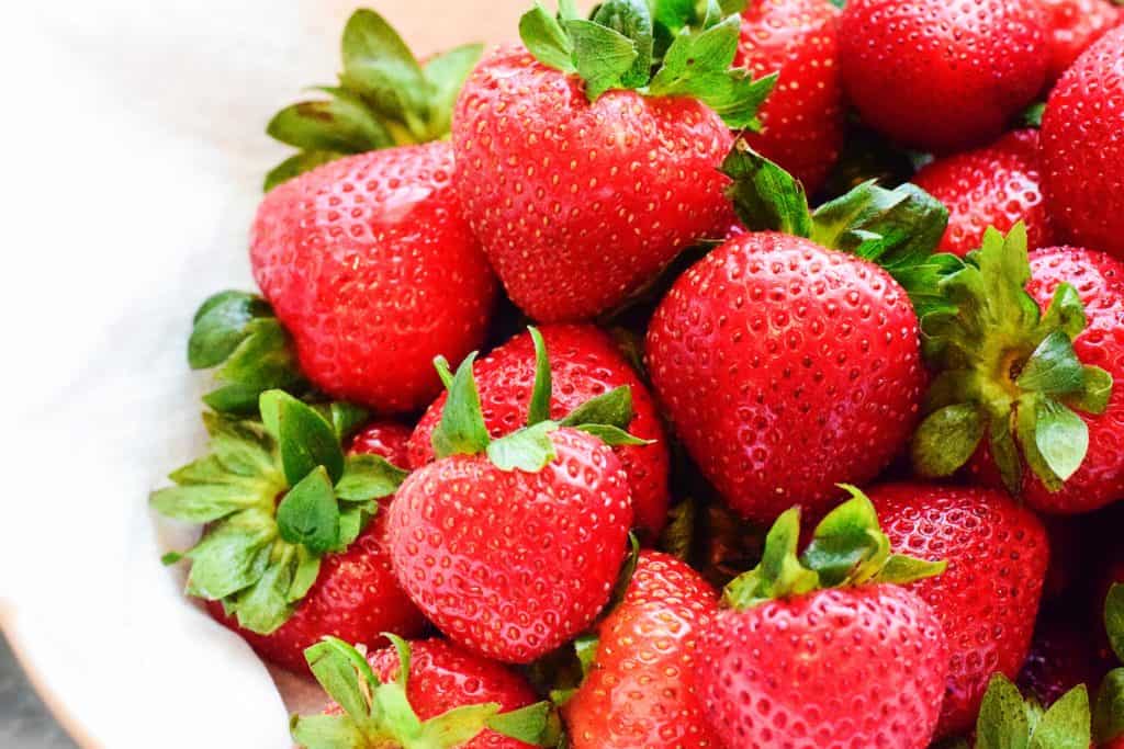 Fresh vibrant strawberries for my yoghurt and muesli cups. 