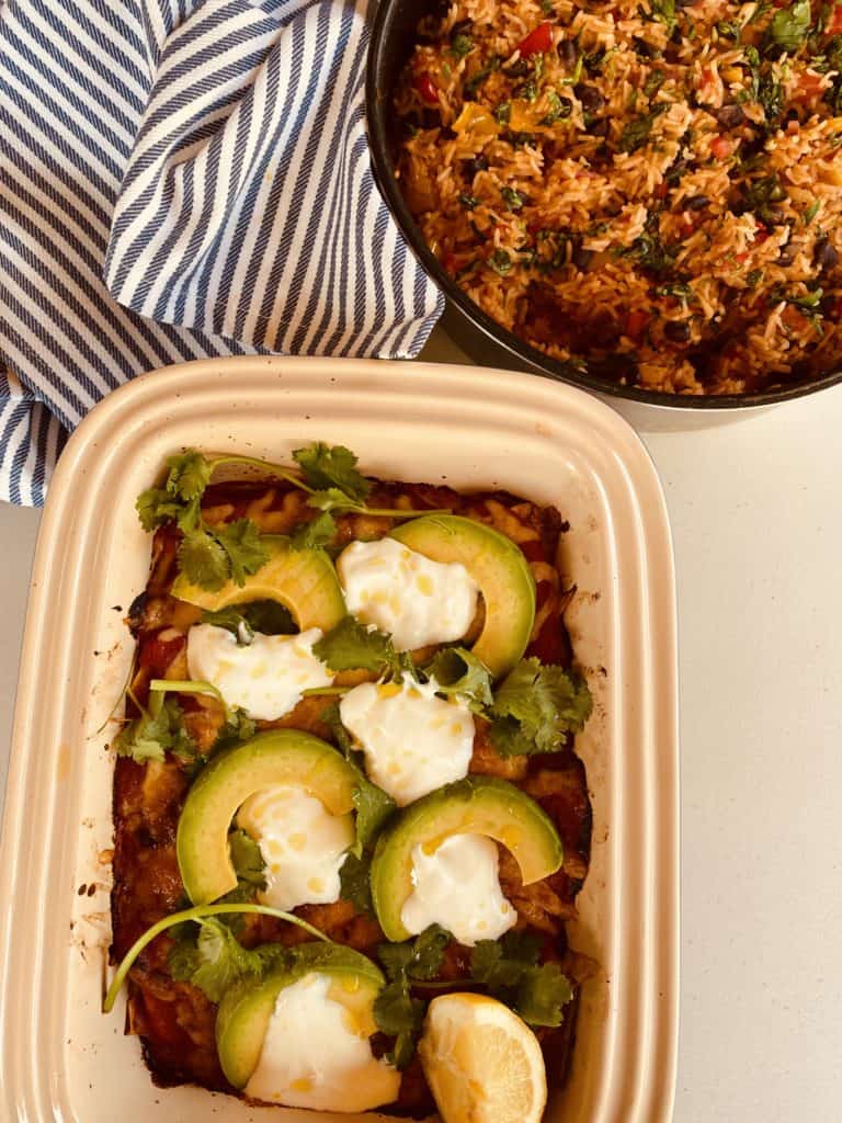 Vegetable enchiladas served with Mexican rice