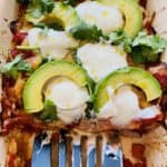 Roasted Veggie Enchiladas topped with Avocado and natural yoghurt