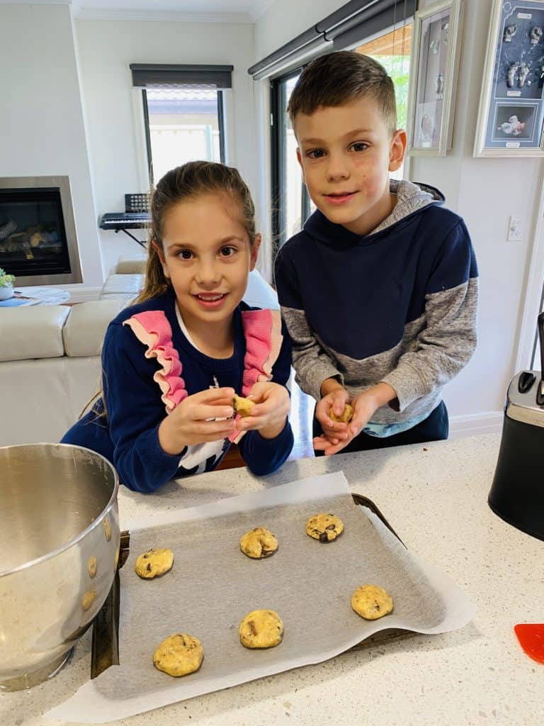 My 7 and 5 year old getting involved in making cookies 