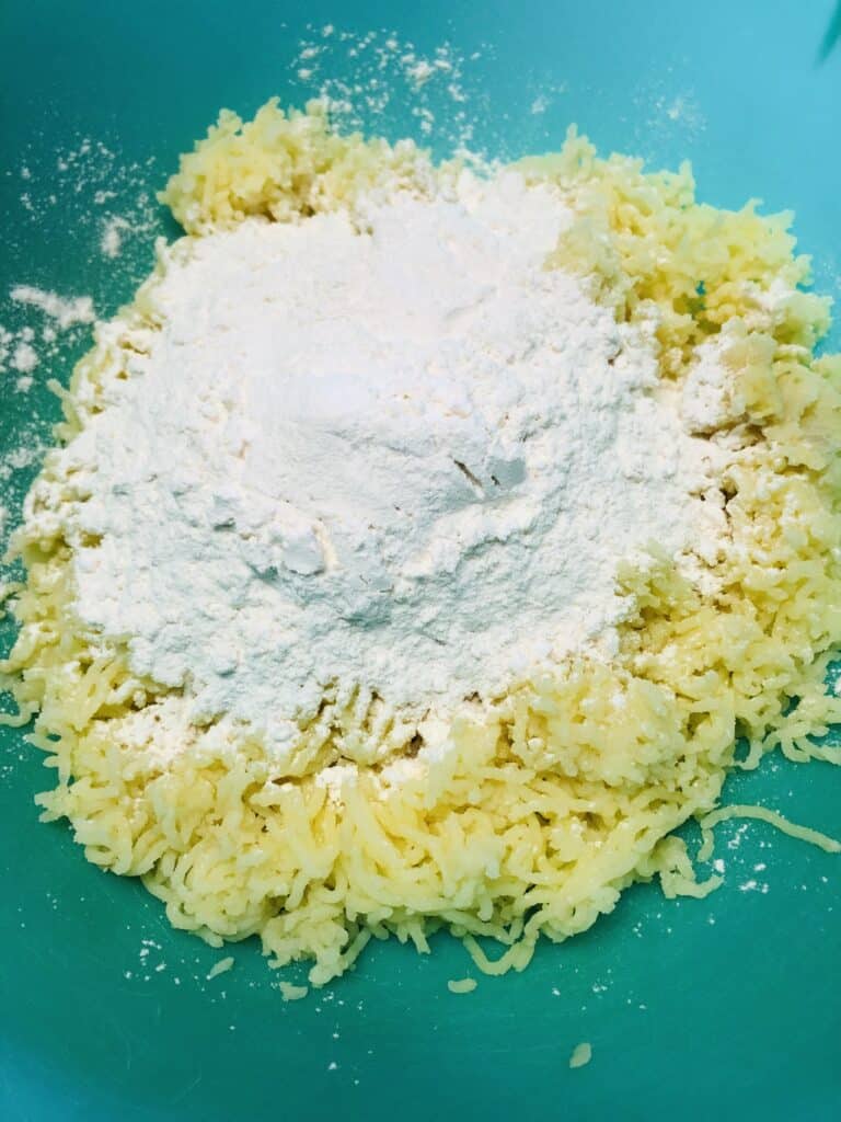 Adding flour to the potato mixture