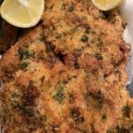 Golden crunchy fish fillets with lemon wedges, perfect for seafood lovers and Australian cuisine enthusiasts.